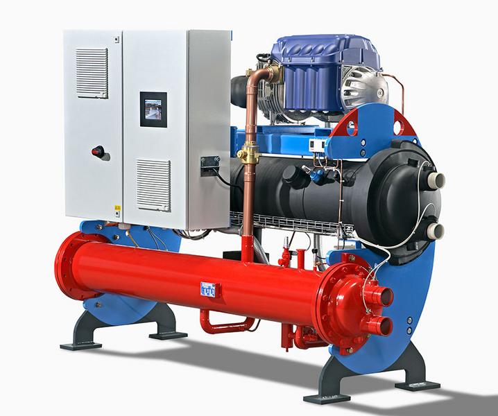 Eine industrielle Maschine mit einem großen, roten Zylinder und einem blauen Gehäuse. An der Seite befindet sich ein Steuerkasten mit einem Display. Die Maschine ist auf einem stabilen Sockel montiert und hat verschiedene Rohre und Anschlüsse.